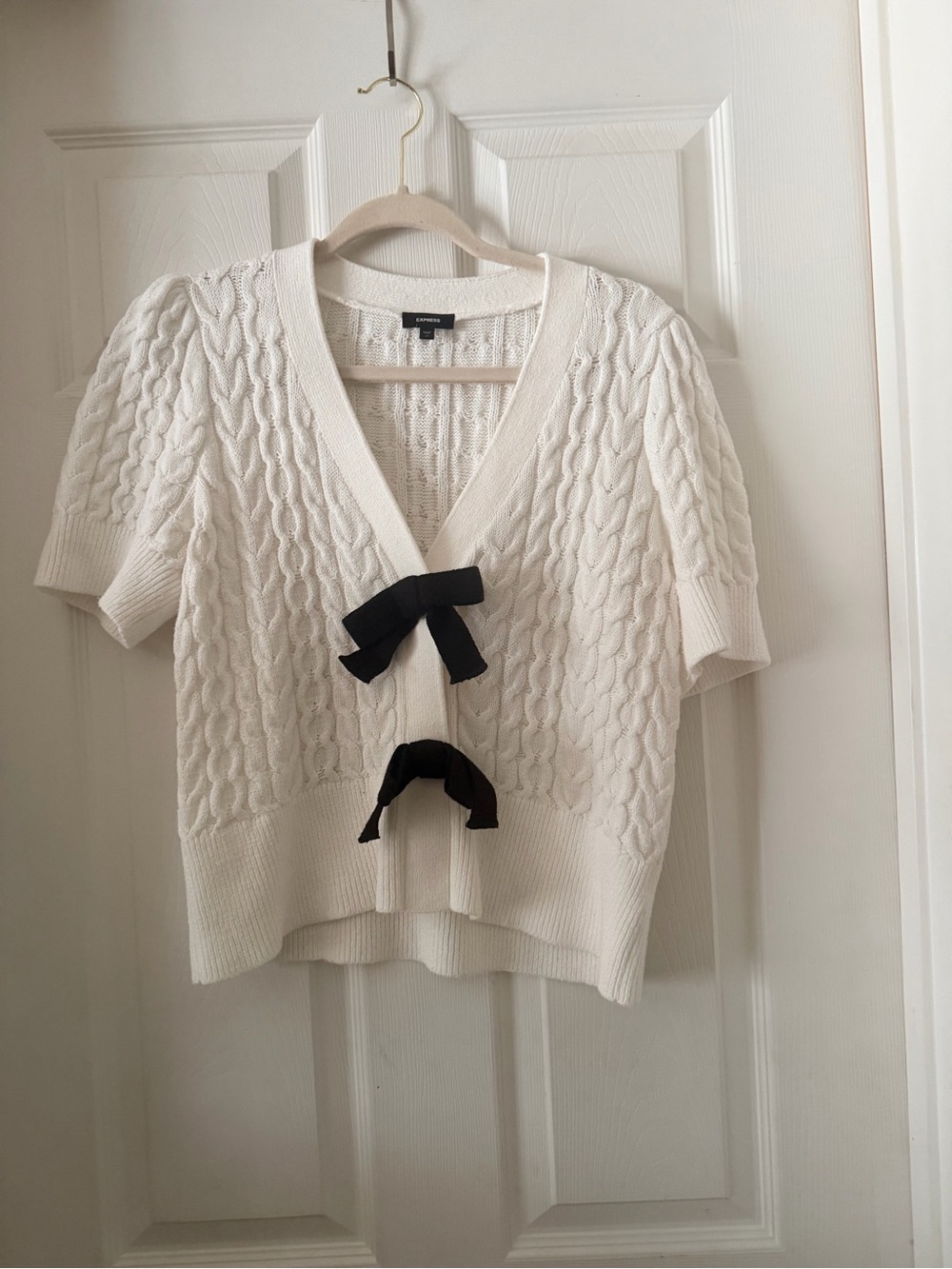 Express Cream Cable-Knit Short Sleeve Cardigan with Black Bows